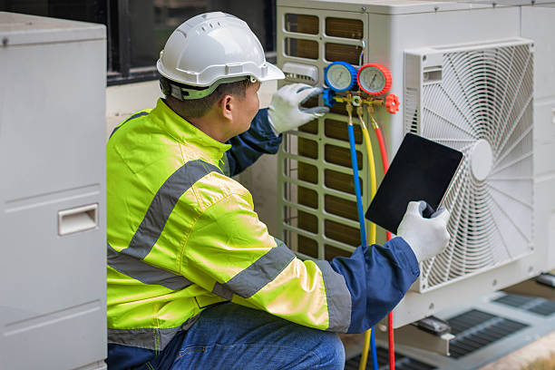 Professional Air Conditioning Repair technician working in Enterprise, WV